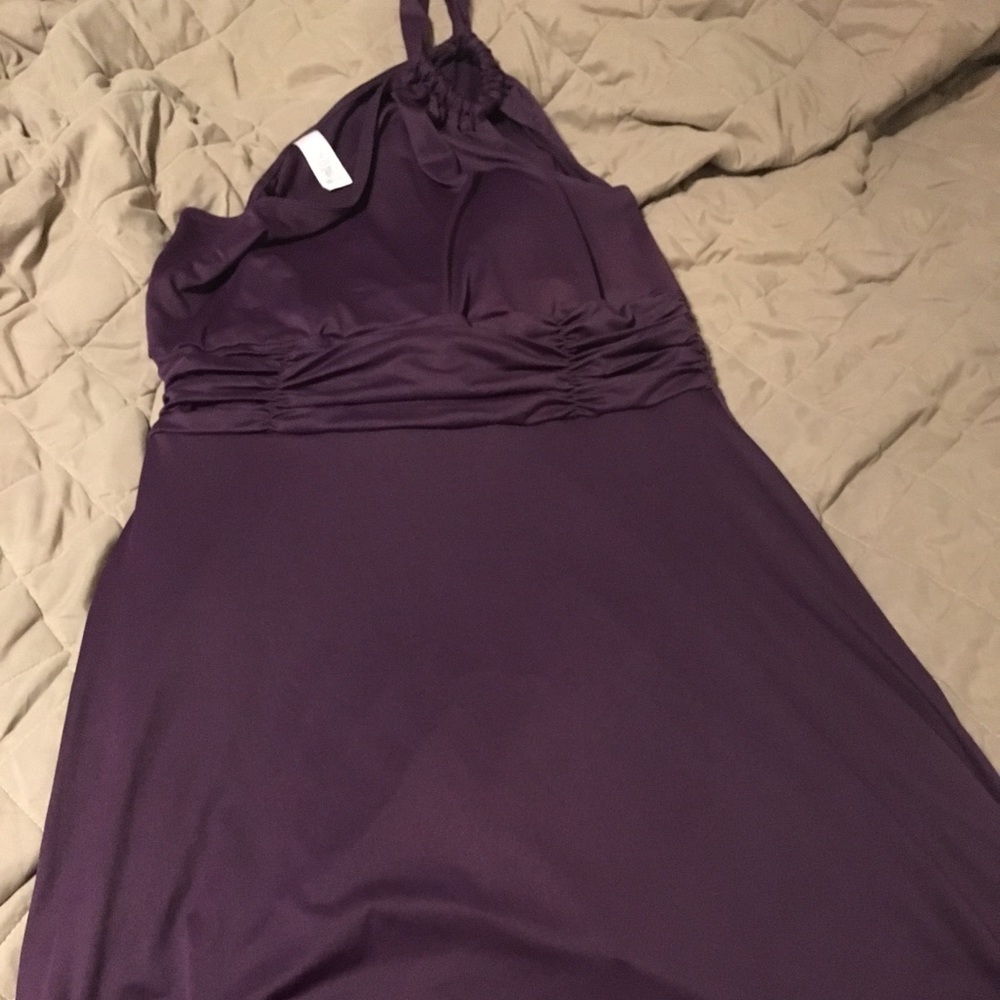One shoulder purple dress.